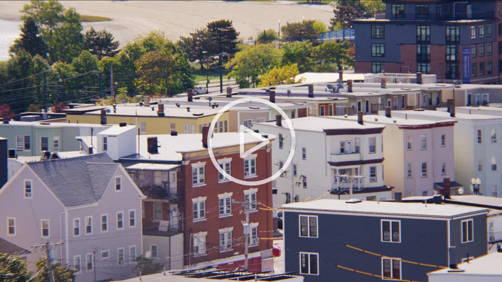 Shot of East Boston housing with play button